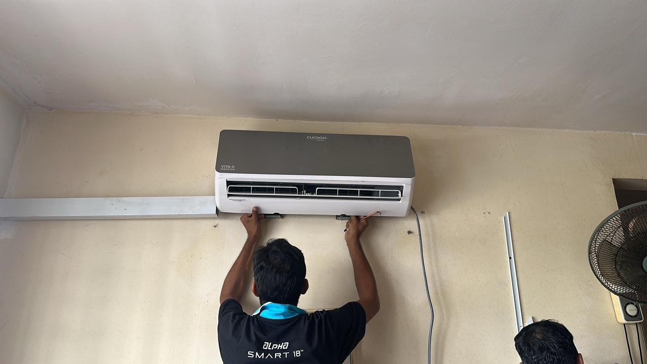 JB Cool Care technician servicing an air conditioner in Johor Bahru